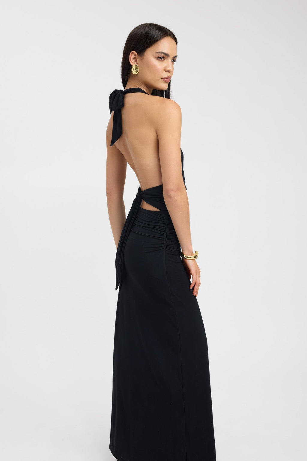 Floor-length dark brown occasion dress with a refined button neckline and fluid silhouette