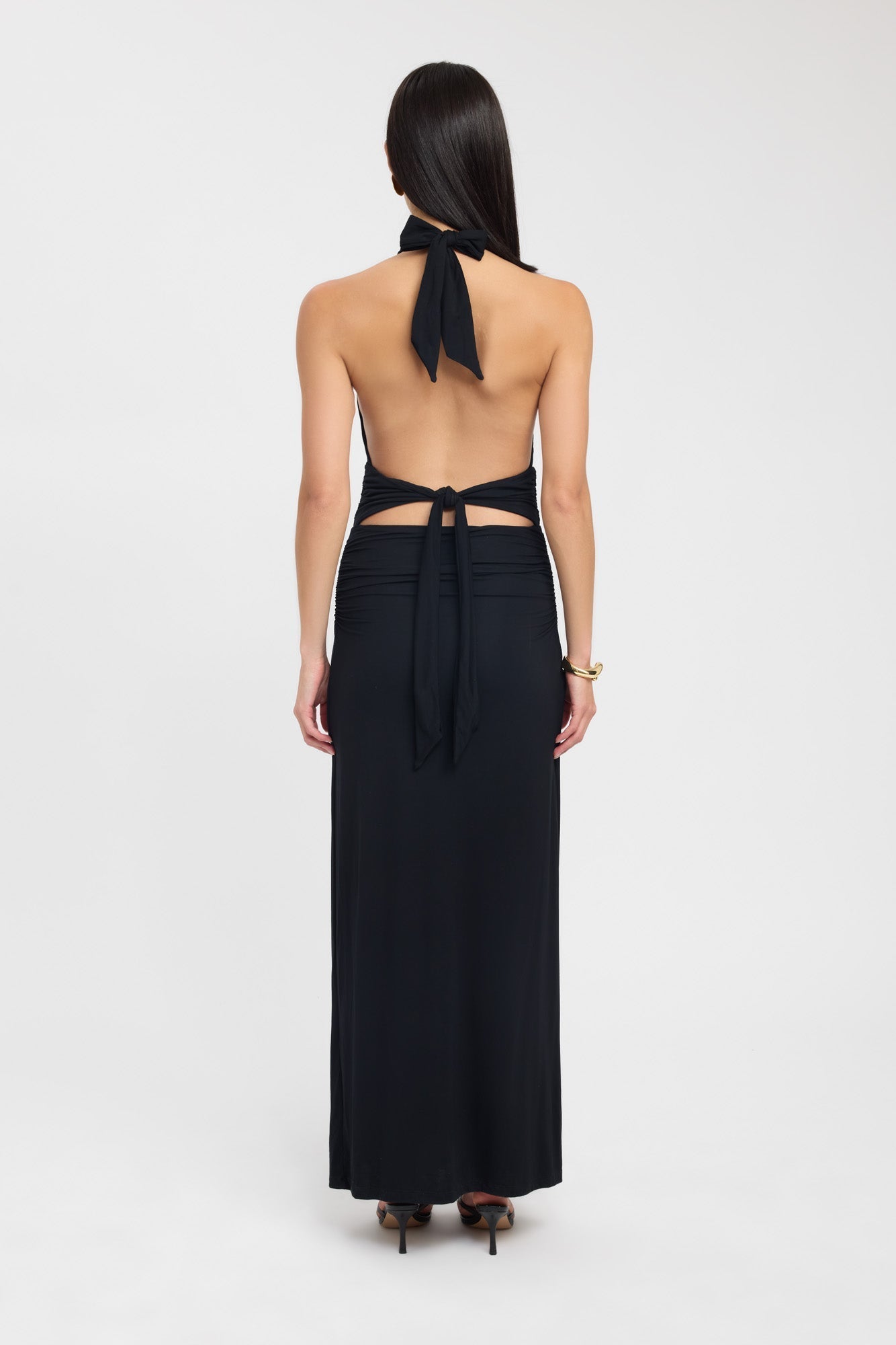 Floor-length dark brown occasion dress with a refined button neckline and fluid silhouette