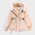 An elegant structured winter coat in camel, styled over a layered winter outfit