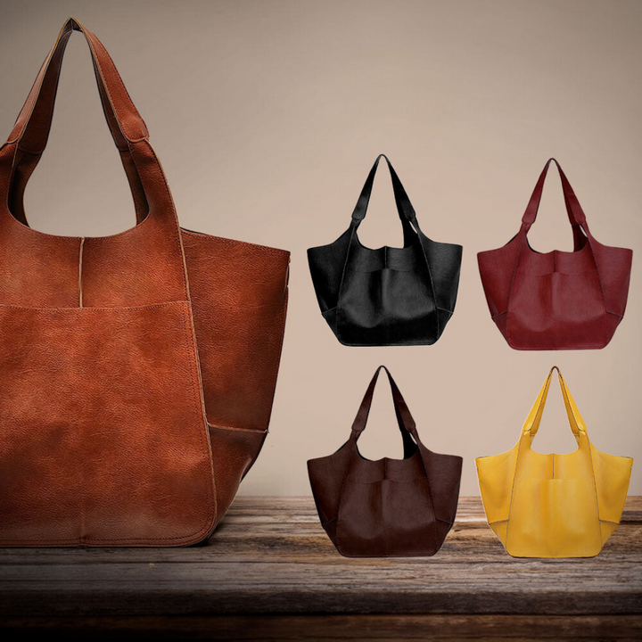 A woman carrying a vintage-style bag with a rich finish on a day out