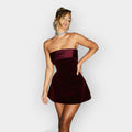 Sleek fitted mini evening dress with a close elegant silhouette