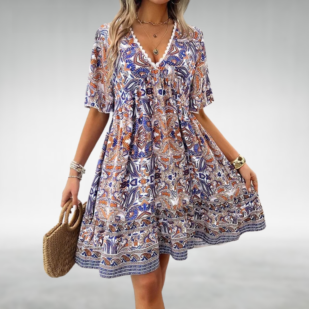 Woman in a patterned boho swing dress with a V-neckline, moving with an easy sway.