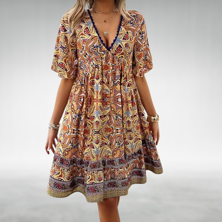 Woman in a patterned boho swing dress with a V-neckline, moving with an easy sway.