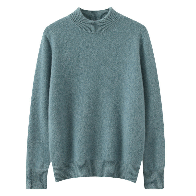 A woman wearing a soft luxe crew neck jumper with a matte finish, styled with smart trousers.