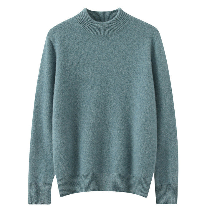 A woman wearing a soft luxe crew neck jumper with a matte finish, styled with smart trousers.