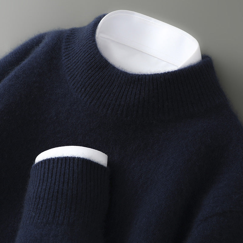 A woman wearing a soft luxe crew neck jumper with a matte finish, styled with smart trousers.