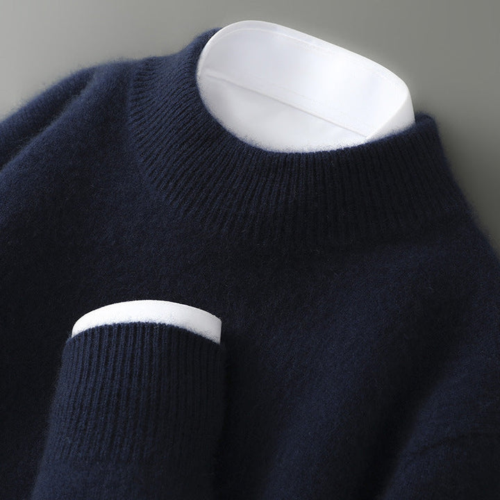 A woman wearing a soft luxe crew neck jumper with a matte finish, styled with smart trousers.