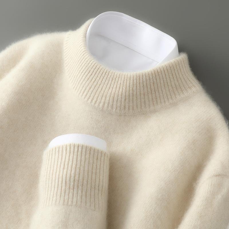 A woman wearing a soft luxe crew neck jumper with a matte finish, styled with smart trousers.