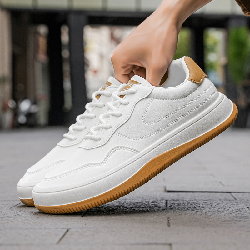 Men's white premium smooth-finish trainers with a clean low-profile silhouette and refined upper