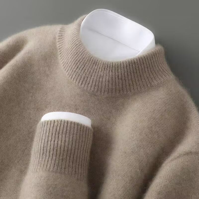 A woman wearing a soft luxe crew neck jumper with a matte finish, styled with smart trousers.