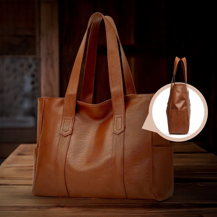 A woman carrying a classic elegant bag with a rich finish over her shoulder
