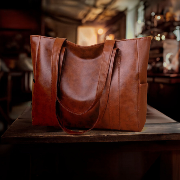 A woman carrying a classic elegant bag with a rich finish over her shoulder