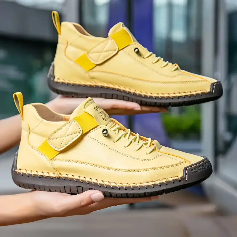 A pair of comfortable slip-on shoes in beige with elastic side panels and a wide toe box