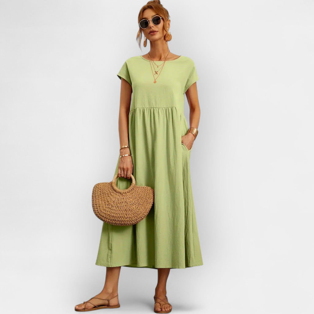 Light white everyday dress with a relaxed silhouette and functional side pockets