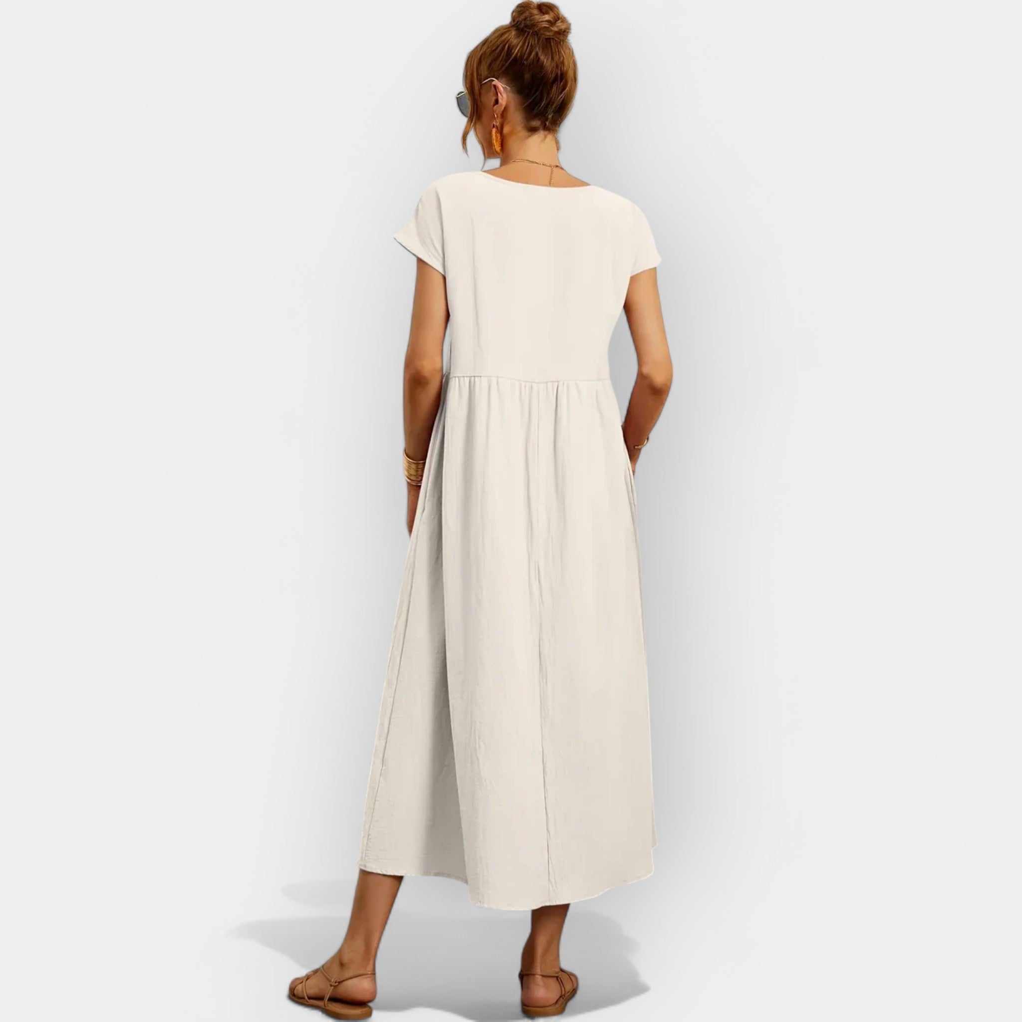 Light white everyday dress with a relaxed silhouette and functional side pockets