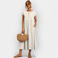 Light white everyday dress with a relaxed silhouette and functional side pockets