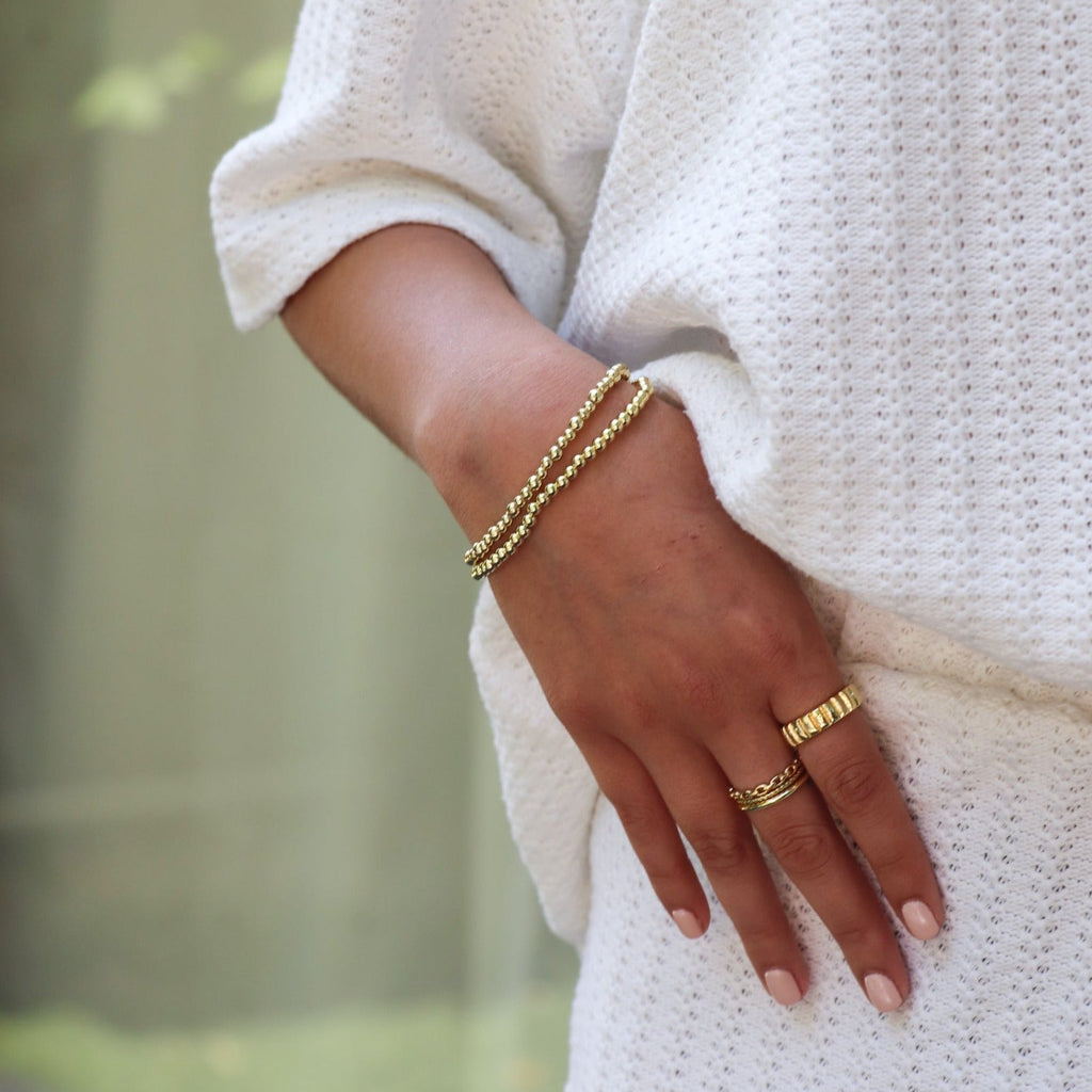 Gold beaded bracelet with smooth lustrous finish