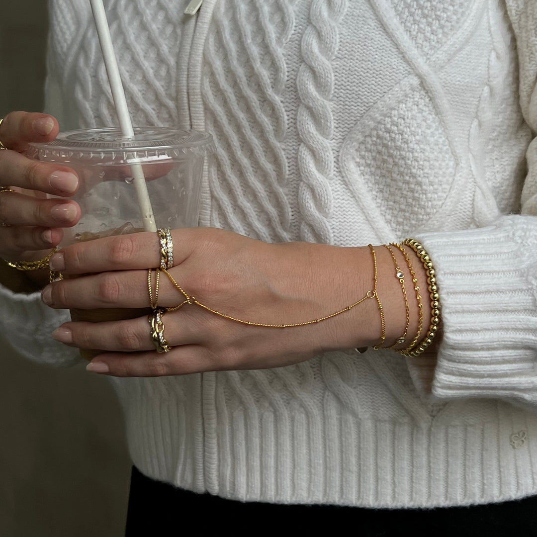 Gold beaded bracelet with smooth lustrous finish