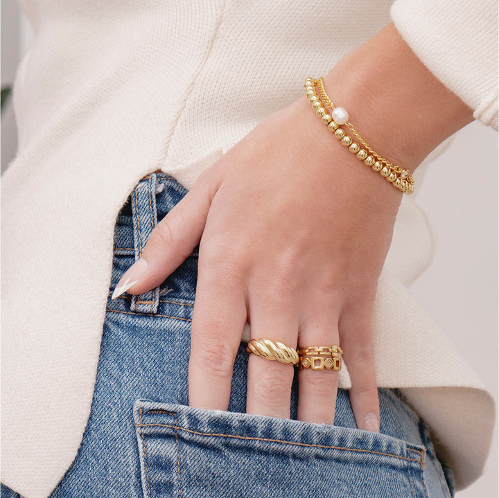 Gold beaded bracelet with smooth lustrous finish