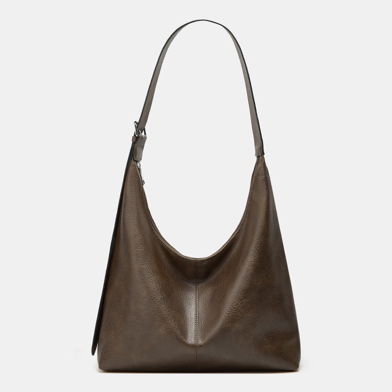 Oversized plain black crossbody bag with a wide shoulder strap