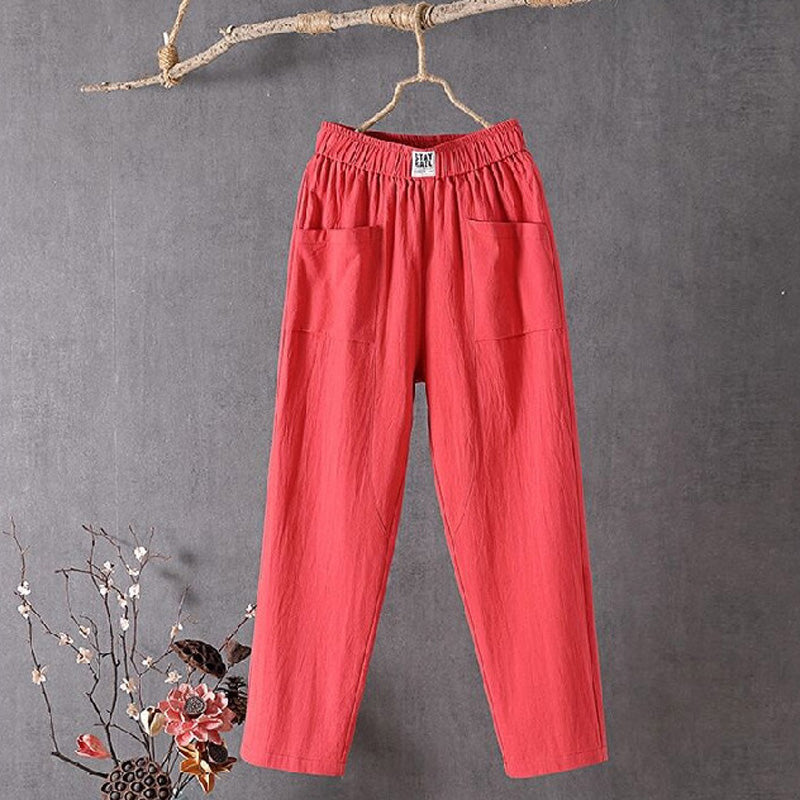 Relaxed tapered trousers with roomy front patch pockets and an elastic waist.