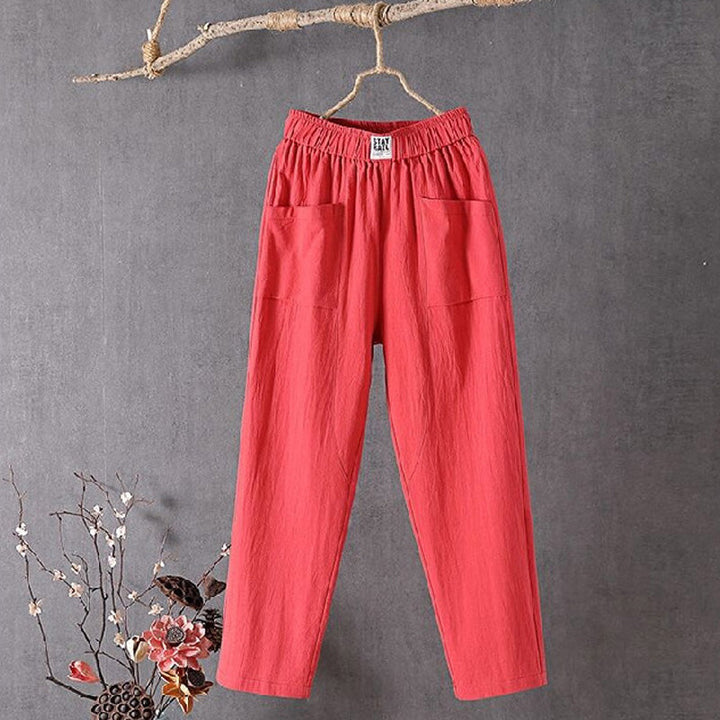 Relaxed tapered trousers with roomy front patch pockets and an elastic waist.
