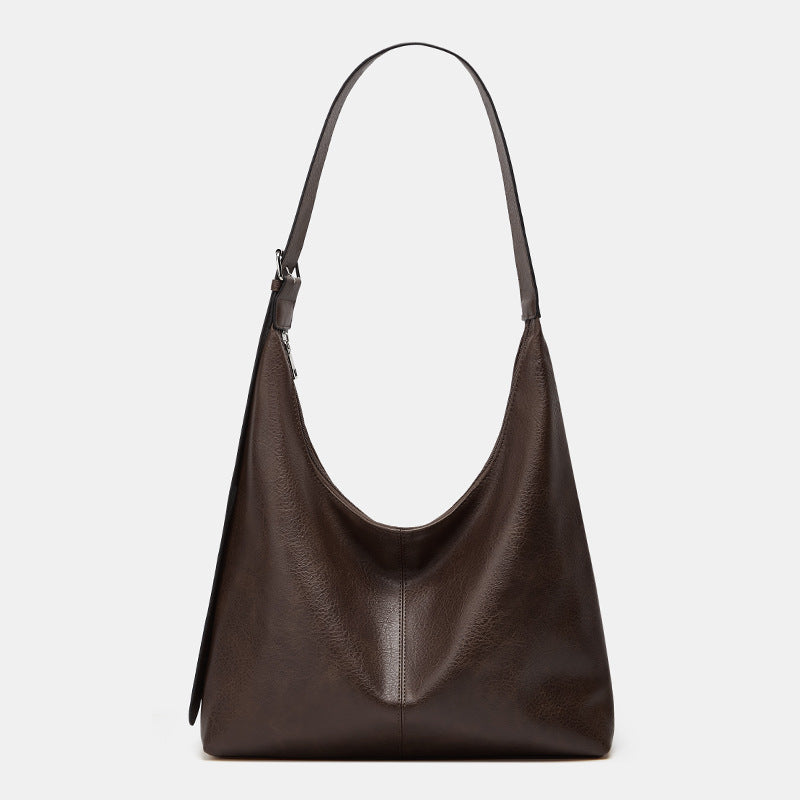 Oversized plain black crossbody bag with a wide shoulder strap