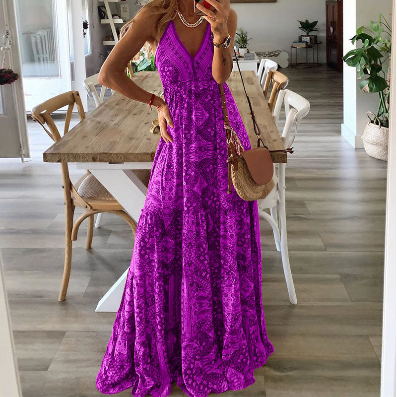 A woman wearing the Attracta sleeveless boho maxi dress with adjustable straps and a flowing tiered skirt.