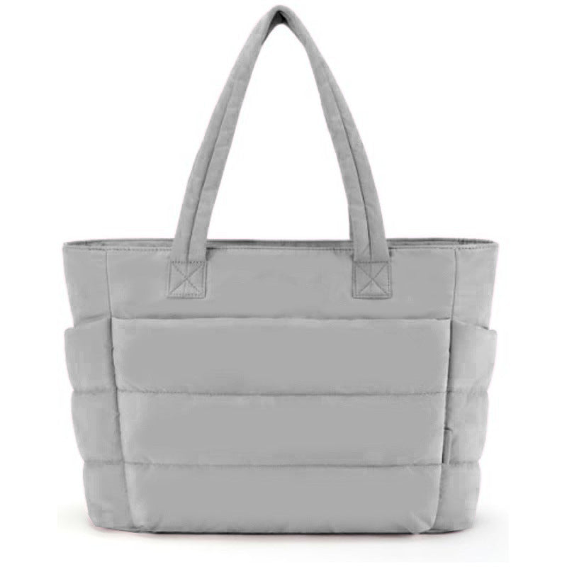Ultralight quilted tote bag in soft pink with zip closure and shoulder straps