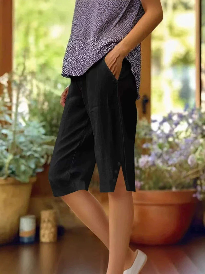 Women's high-waist shorts in dark khaki with an elasticated waistband and relaxed leg
