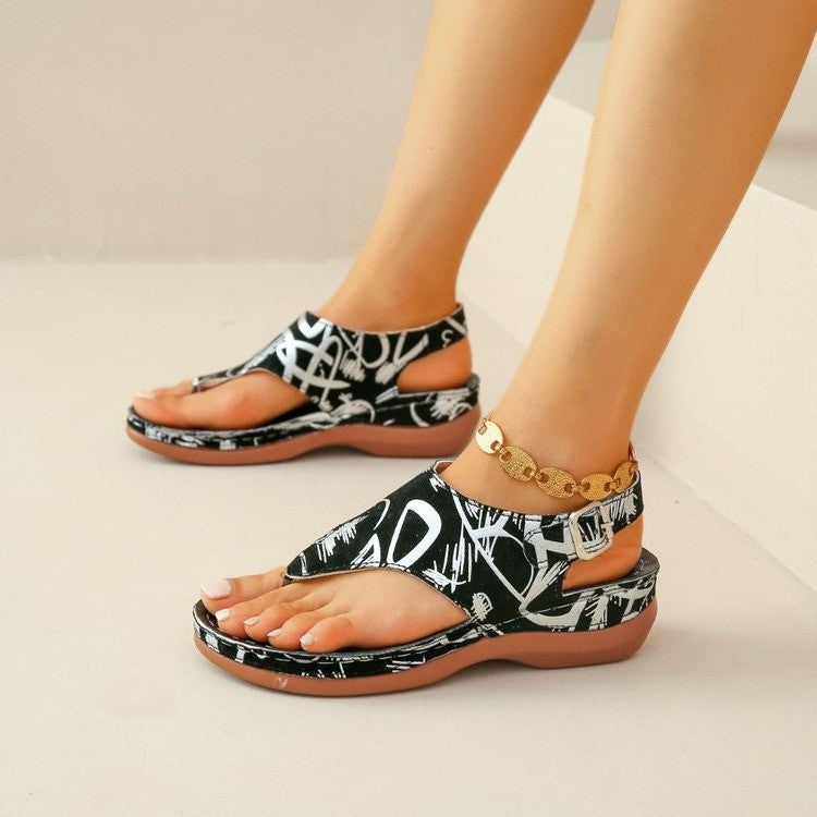 Floral print toe-post sandals with a back strap in white, black and white, and black