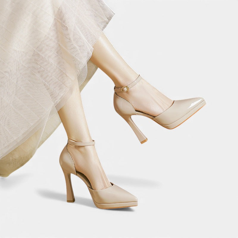 A woman in pointed ankle-strap pumps with a block heel, dressed for a day-to-night occasion.