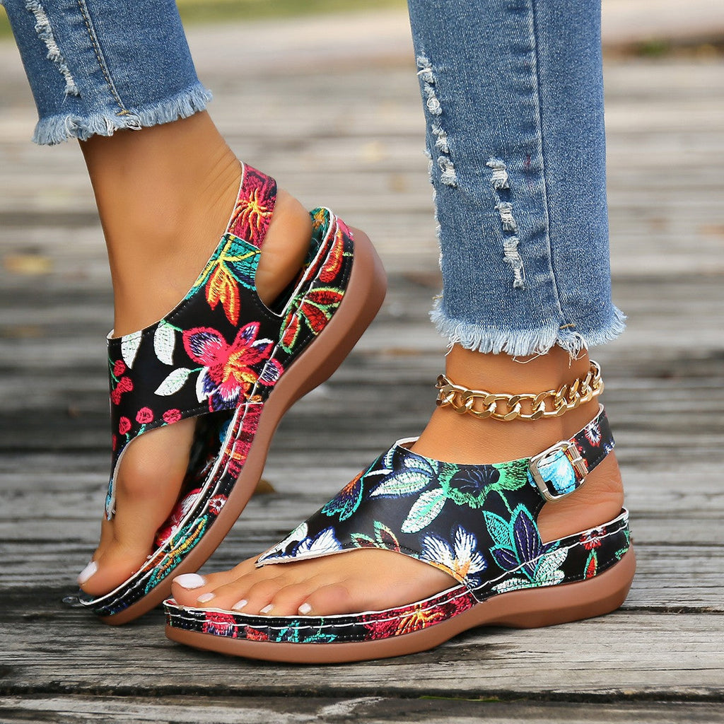 Floral print toe-post sandals with a back strap in white, black and white, and black