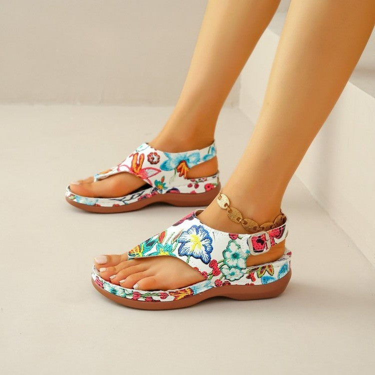 Floral print toe-post sandals with a back strap in white, black and white, and black
