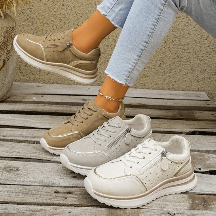 A woman standing comfortably in orthopaedic arch support trainers.