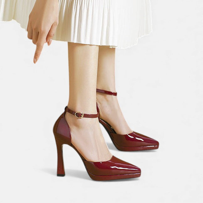 A woman in pointed ankle-strap pumps with a block heel, dressed for a day-to-night occasion.
