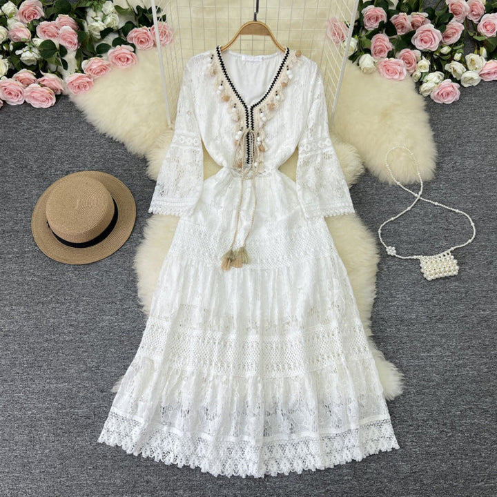 Woman twirling in the Florence romantic boho maxi dress with delicate floral detailing and a ruffled hem.