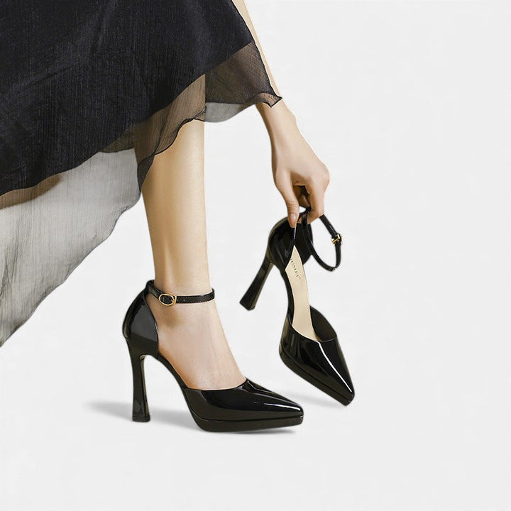 A woman in pointed ankle-strap pumps with a block heel, dressed for a day-to-night occasion.