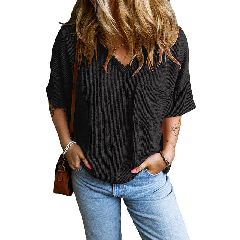 Grey relaxed V-neck top with wide sleeves and a small front pocket