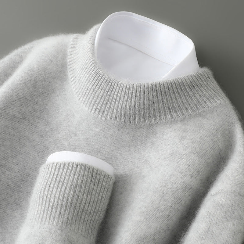 A woman wearing a soft luxe crew neck jumper with a matte finish, styled with smart trousers.