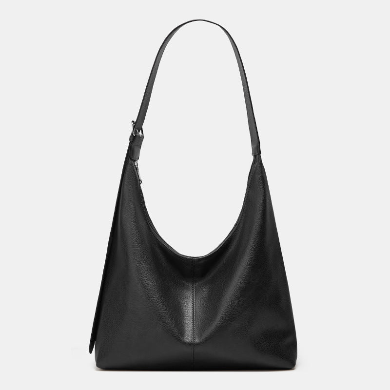 Oversized plain black crossbody bag with a wide shoulder strap