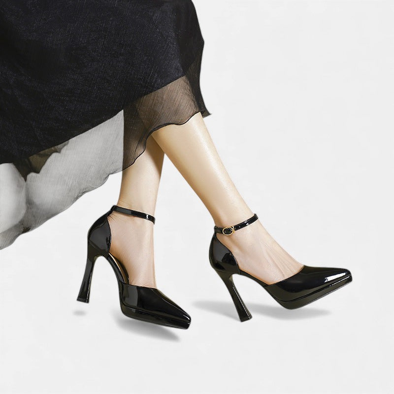 A woman in pointed ankle-strap pumps with a block heel, dressed for a day-to-night occasion.