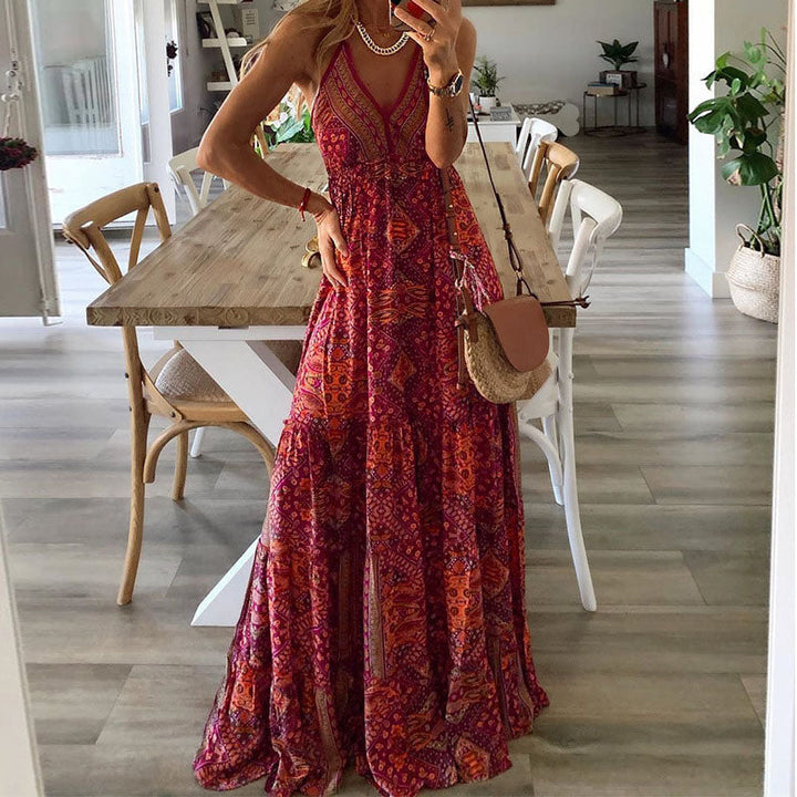 A woman wearing the Attracta sleeveless boho maxi dress with adjustable straps and a flowing tiered skirt.