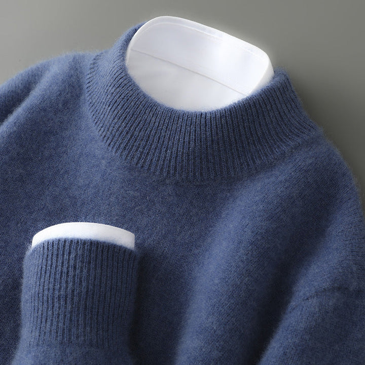 A woman wearing a soft luxe crew neck jumper with a matte finish, styled with smart trousers.