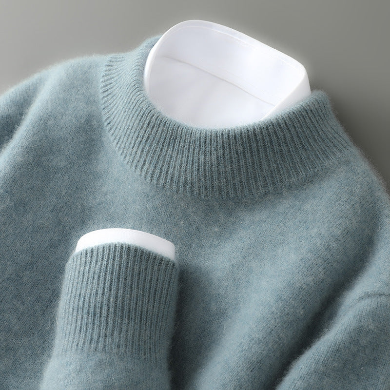 A woman wearing a soft luxe crew neck jumper with a matte finish, styled with smart trousers.