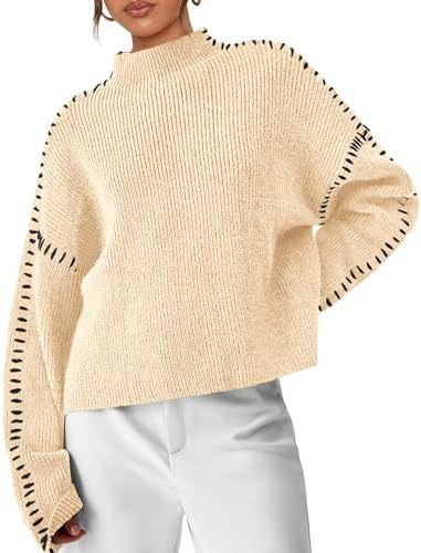 A woman wearing an oversized mock-neck jumper with whipstitch detailing, cosy and stylish.