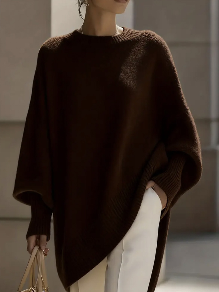 A woman wearing a soft crew neck jumper with jeans for a warm, easy everyday look.