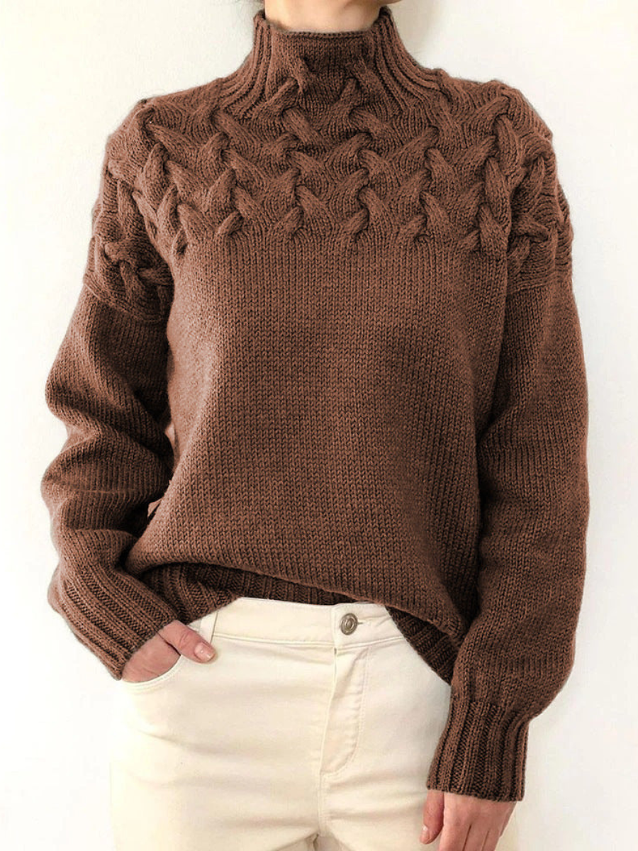 A woman wearing a warm roll-neck jumper, cosy and elegant on a cold winter day.