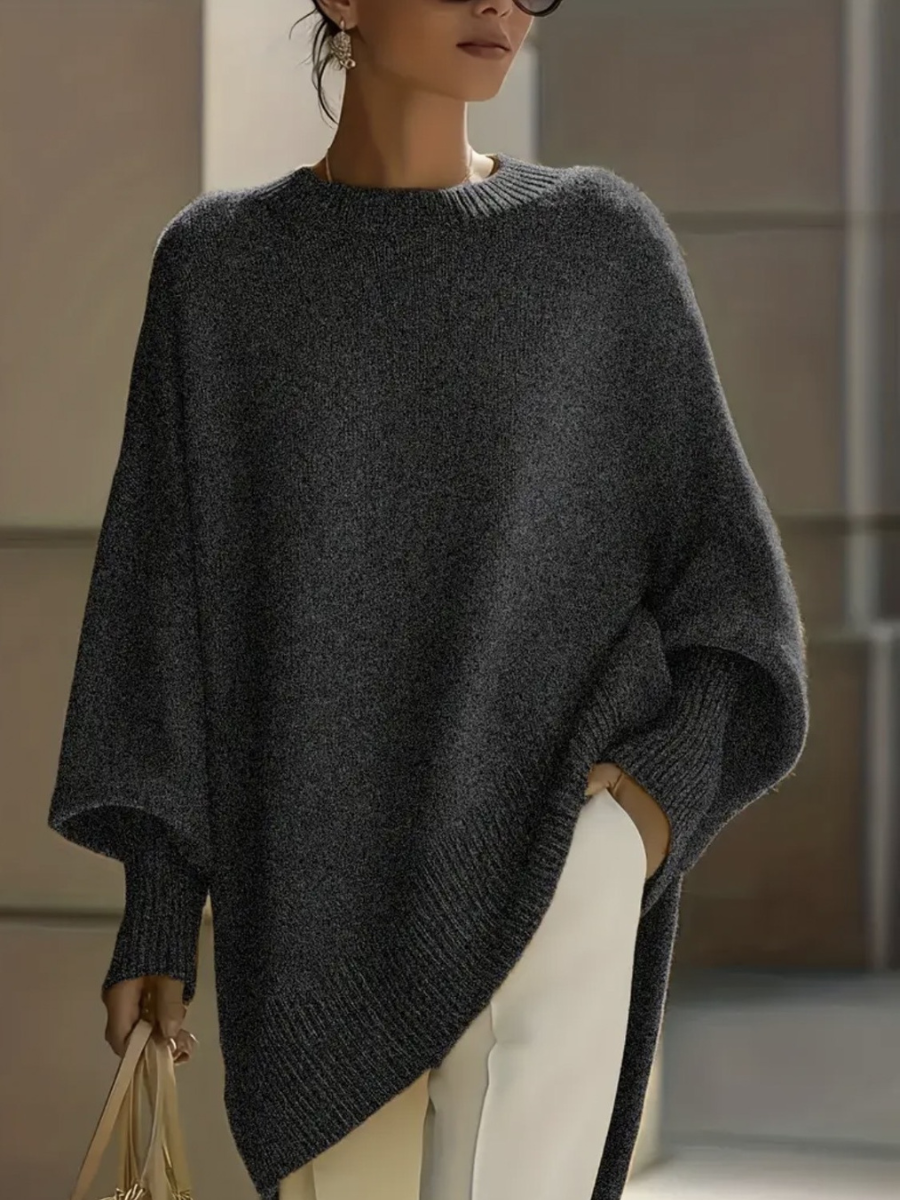 A woman wearing a soft crew neck jumper with jeans for a warm, easy everyday look.