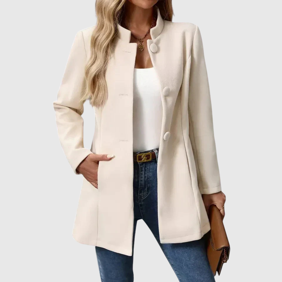 A woman wearing a collarless tailored jacket with a button front